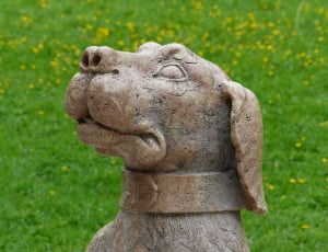 brown dog concrete statuette thumbnail