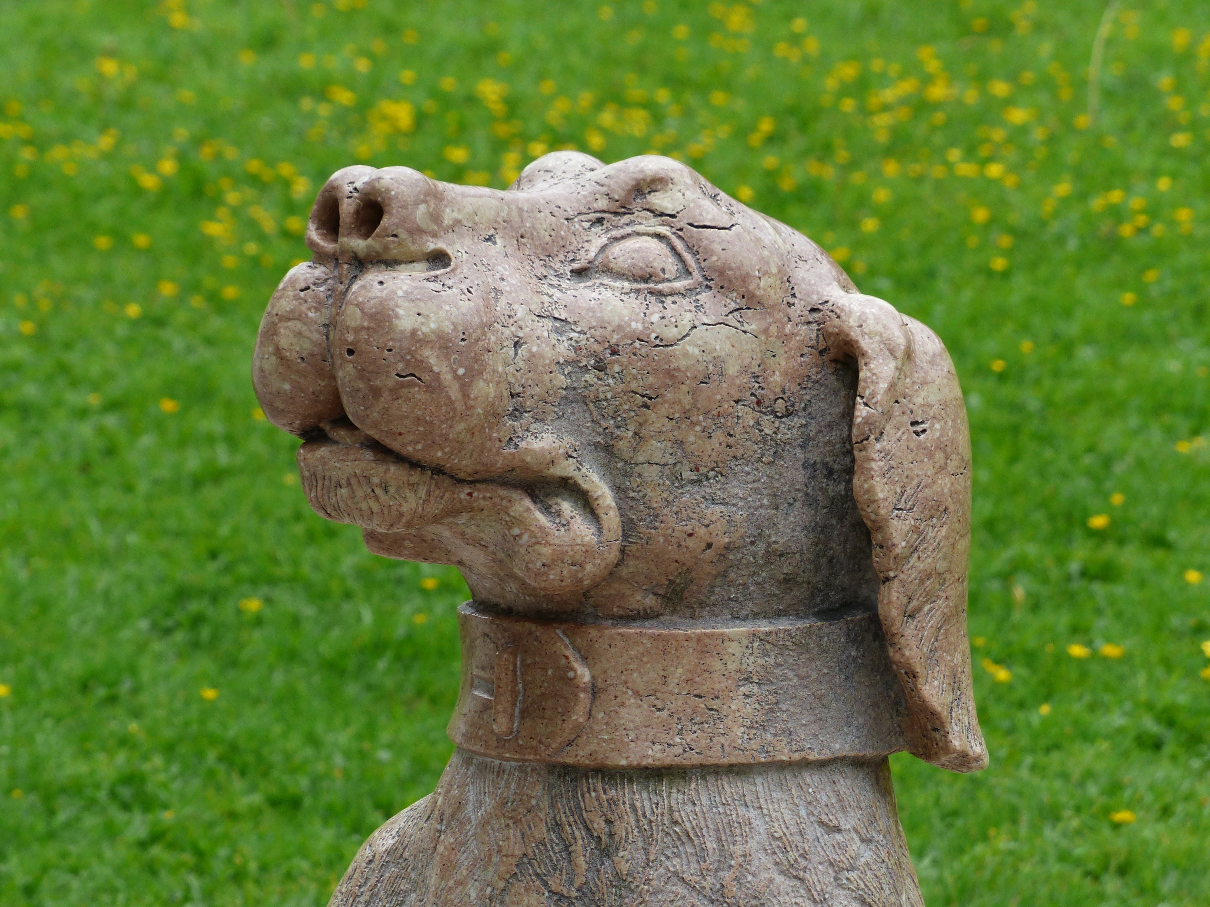 brown dog concrete statuette