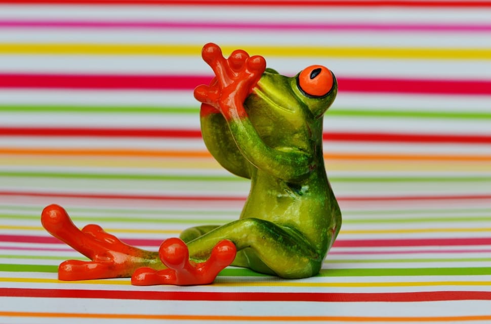 green, red and orange frog figurine preview