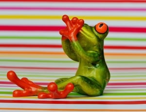 green, red and orange frog figurine thumbnail