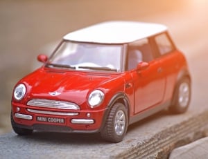 red and white die cast model mini cooper car thumbnail