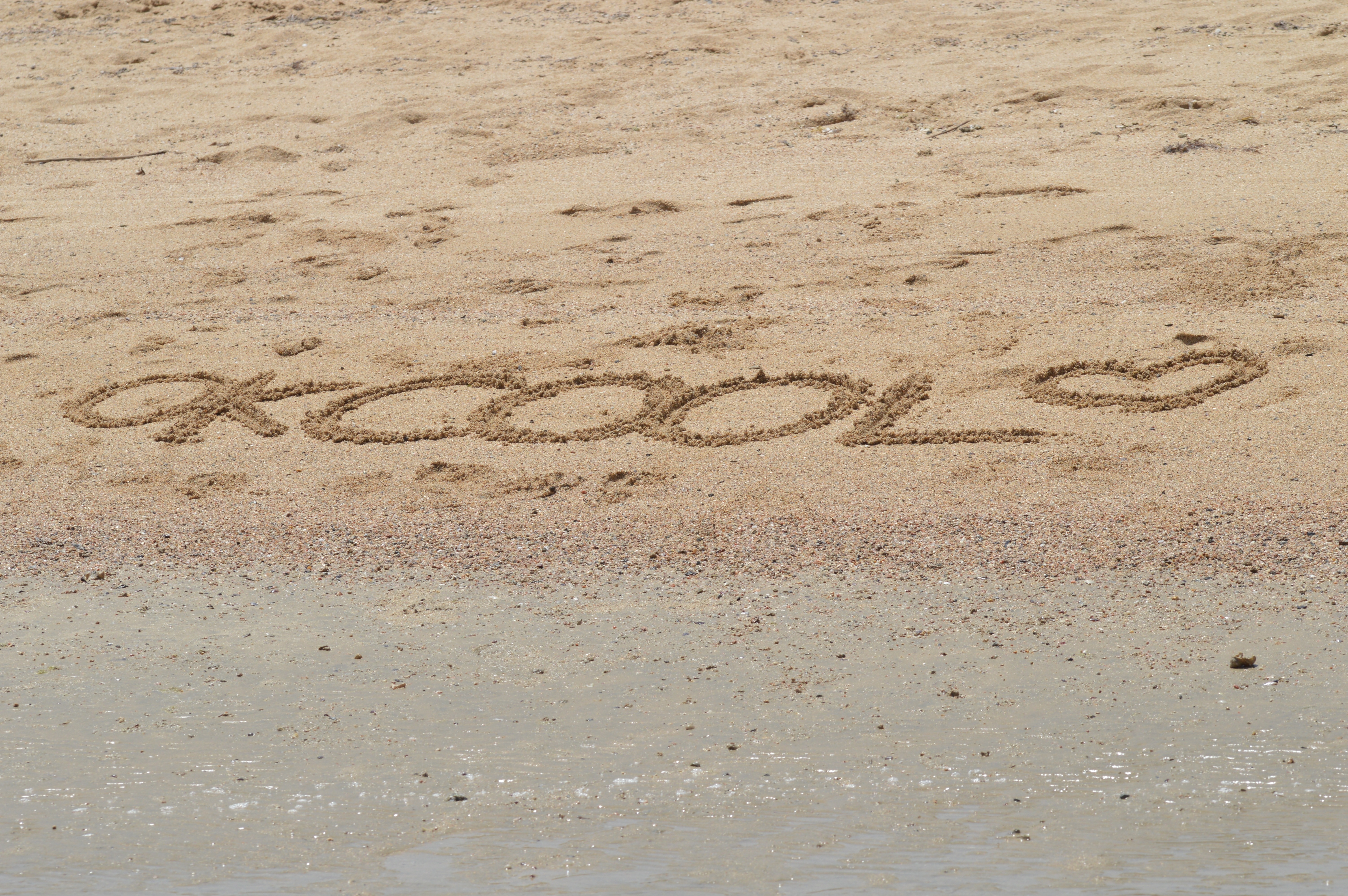 okcool written on sand