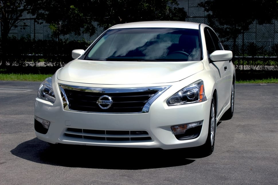 white nissan car at broad day lit preview