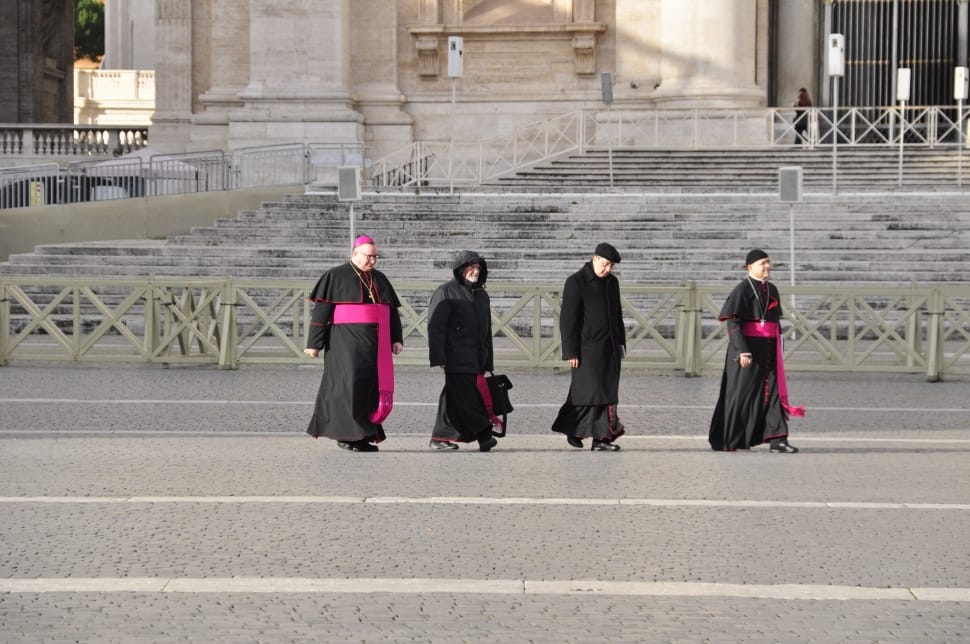 four pope walking on pathway during day time preview