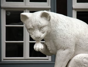 white cat concrete statuette thumbnail