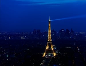 yellow lighted eiffel tower at nighttime thumbnail