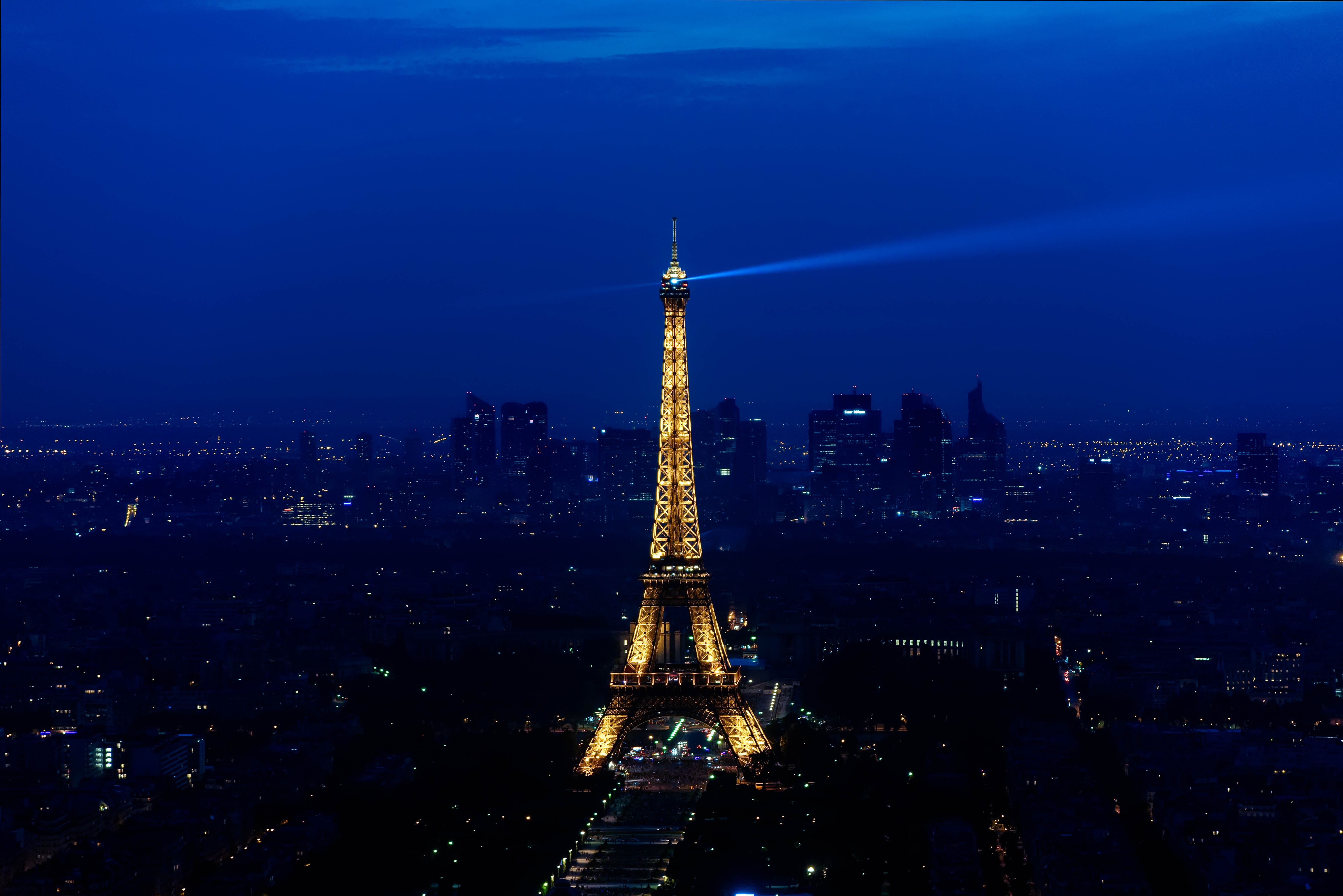 yellow lighted eiffel tower at nighttime