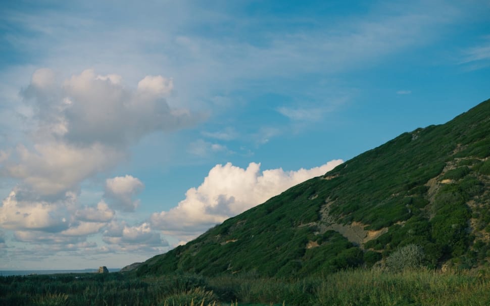 green mountain and cumulus clouds preview