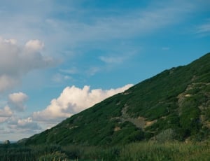 green mountain and cumulus clouds thumbnail