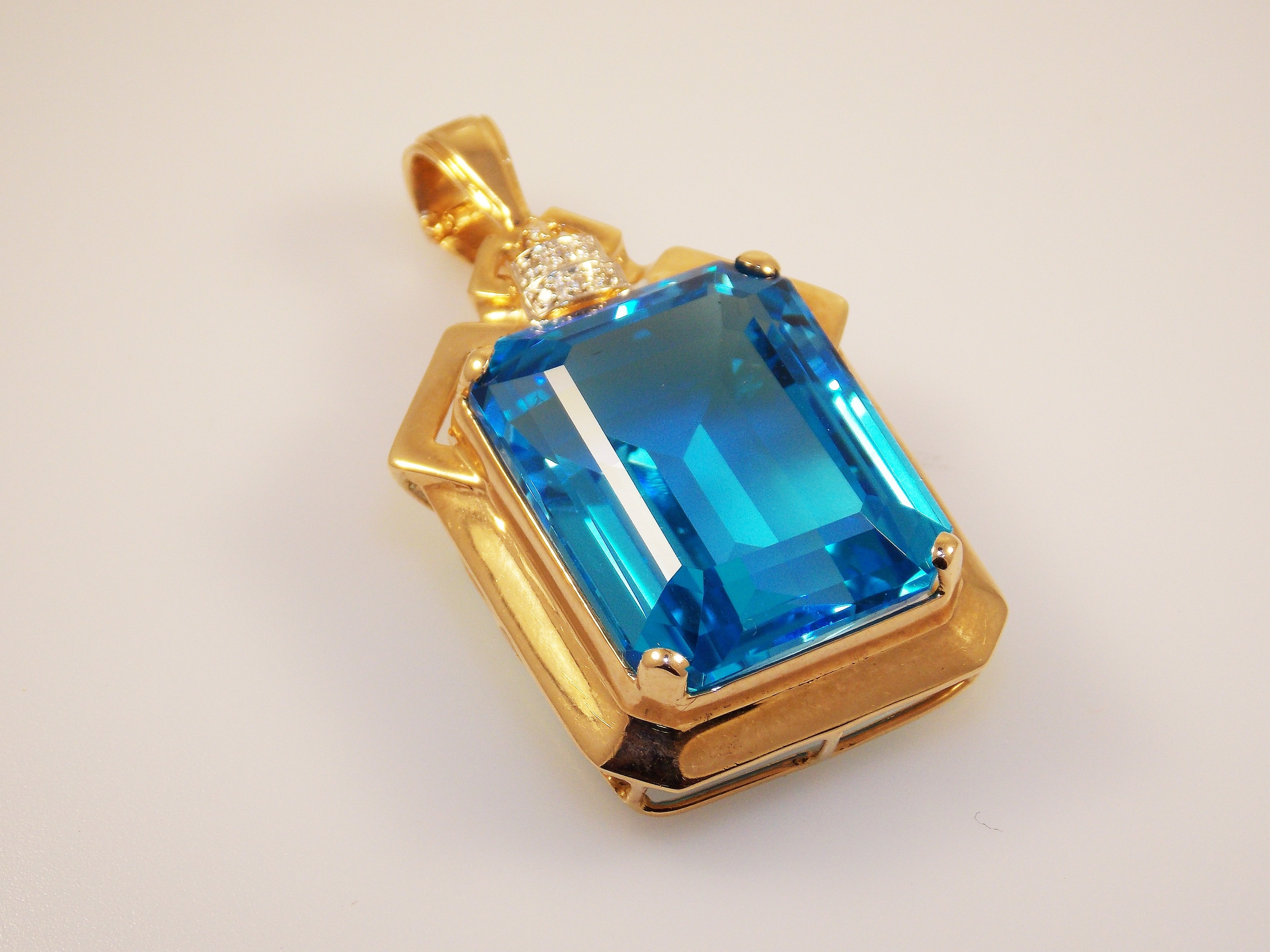 gold blue rectangle gemstone cut pendant