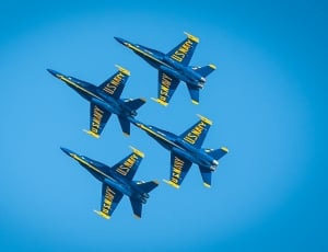 4 blue and yellow u.s. navy jet fighter thumbnail