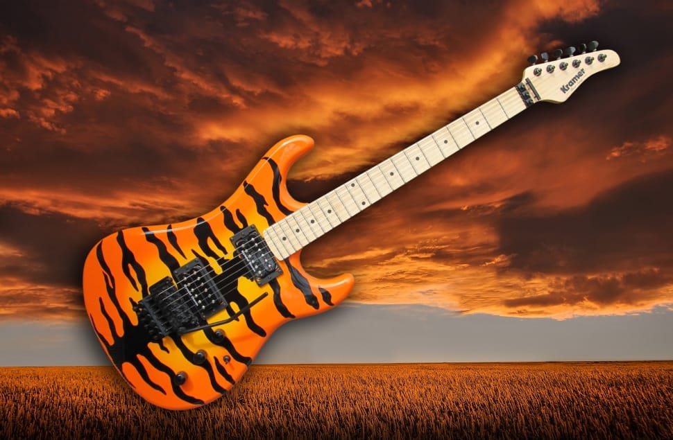 photograph of beige and orange electric guitar preview