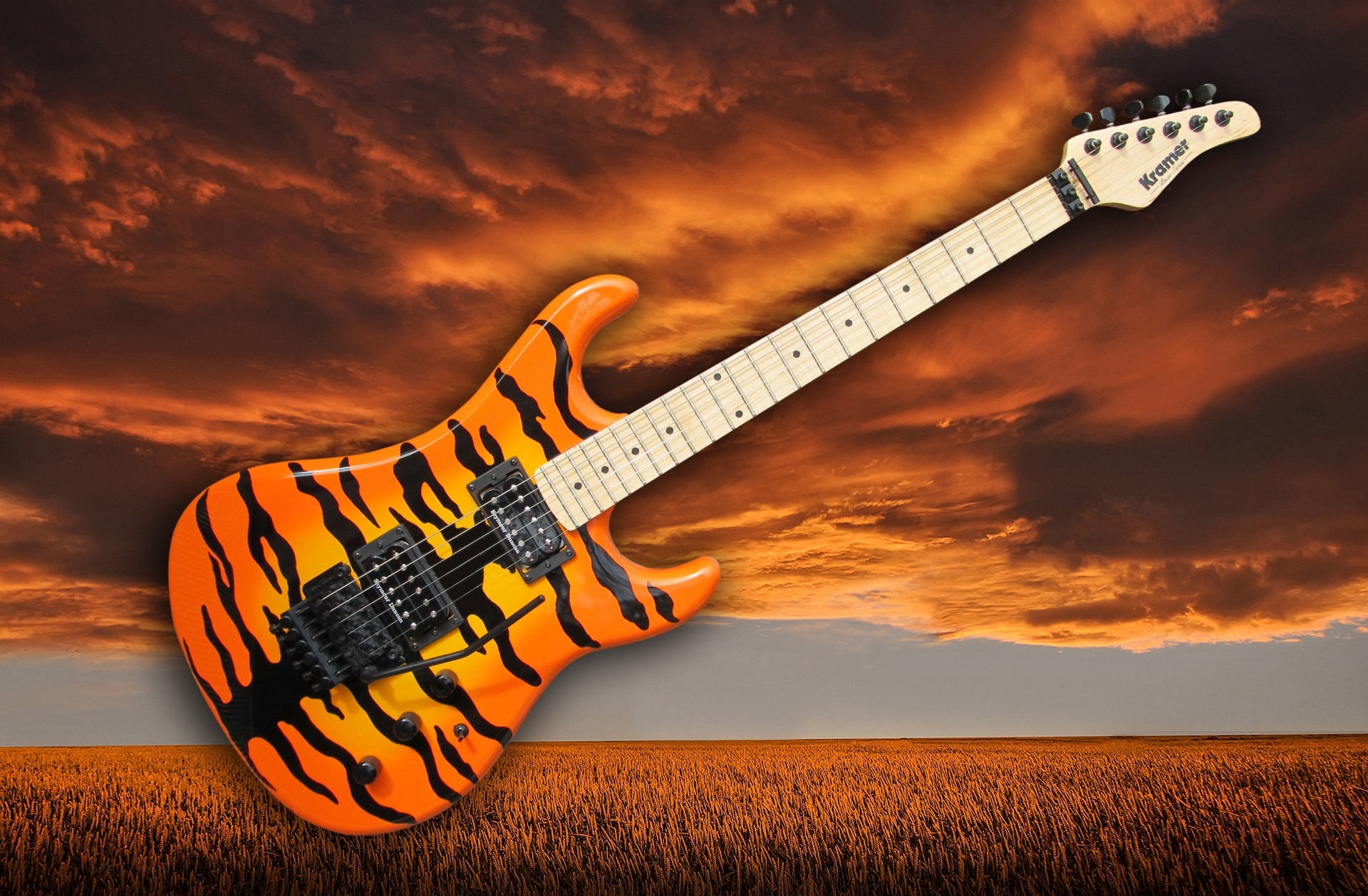 photograph of beige and orange electric guitar