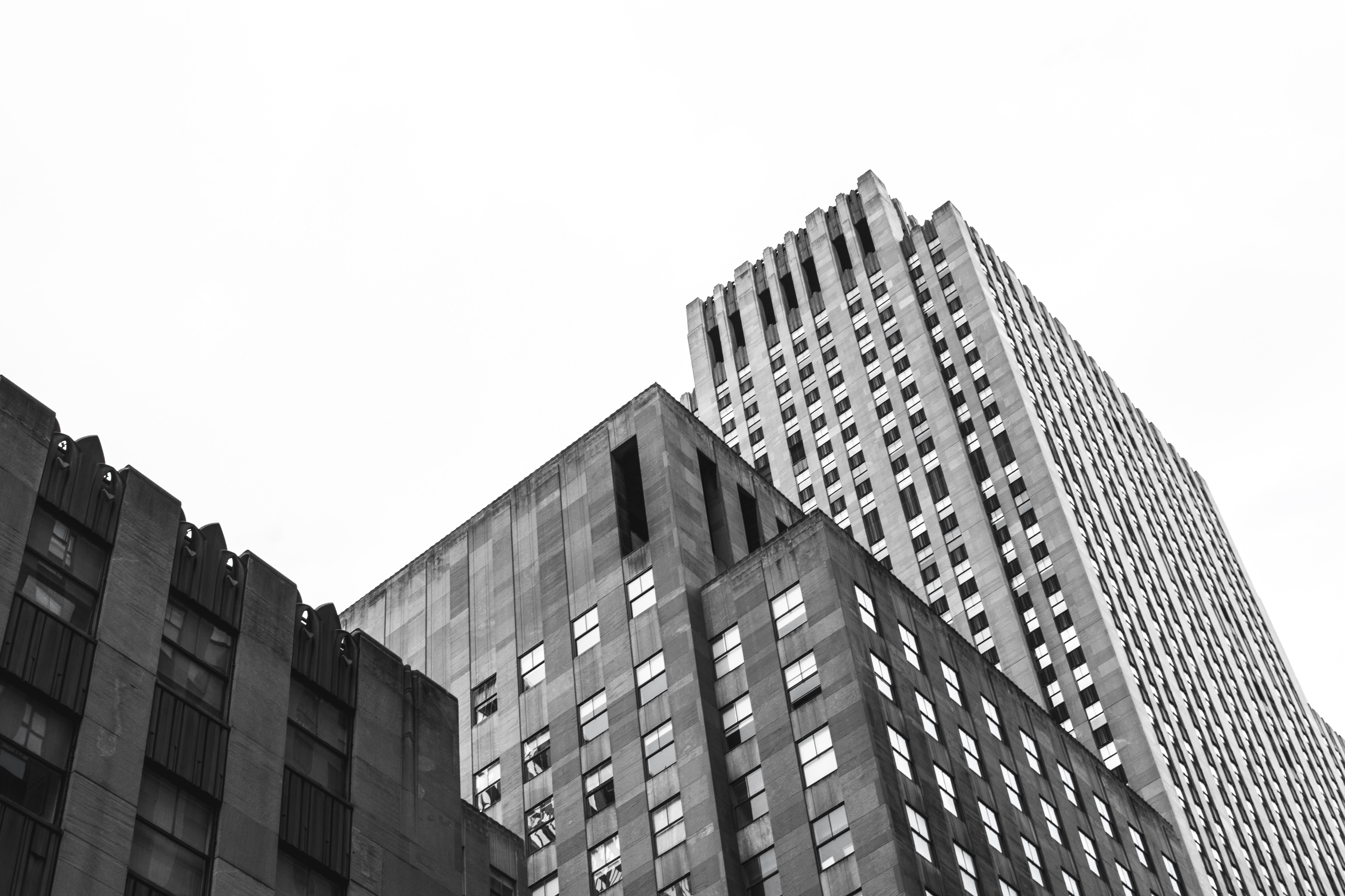 grayscale photo of high rise concrete building