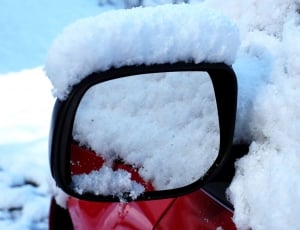 red Car's Side mirror with snow thumbnail