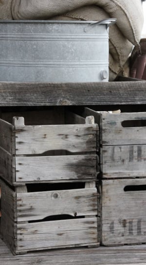 gray metal bucket and brown wooden crates thumbnail