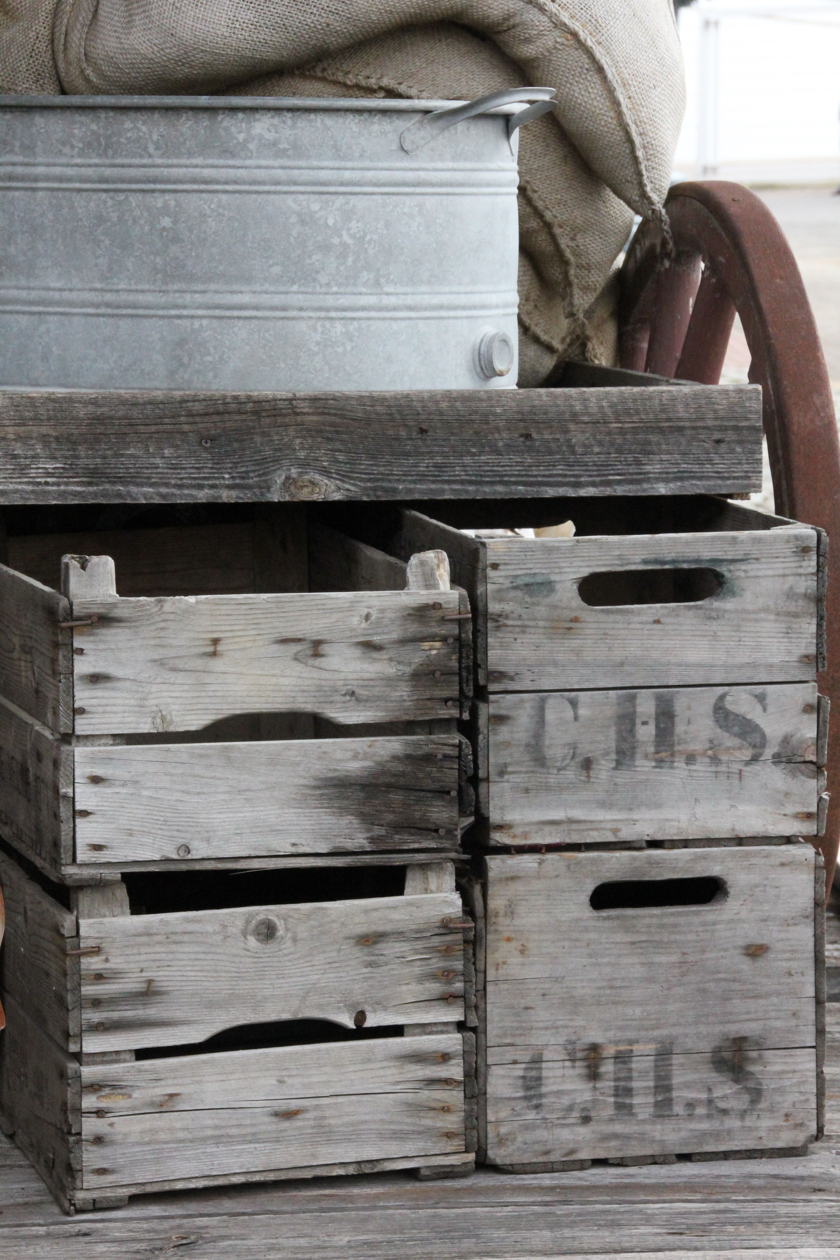 gray metal bucket and brown wooden crates