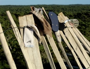 brown wooden fence with slippers thumbnail