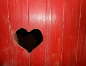 red wooden surface with heart slot thumbnail