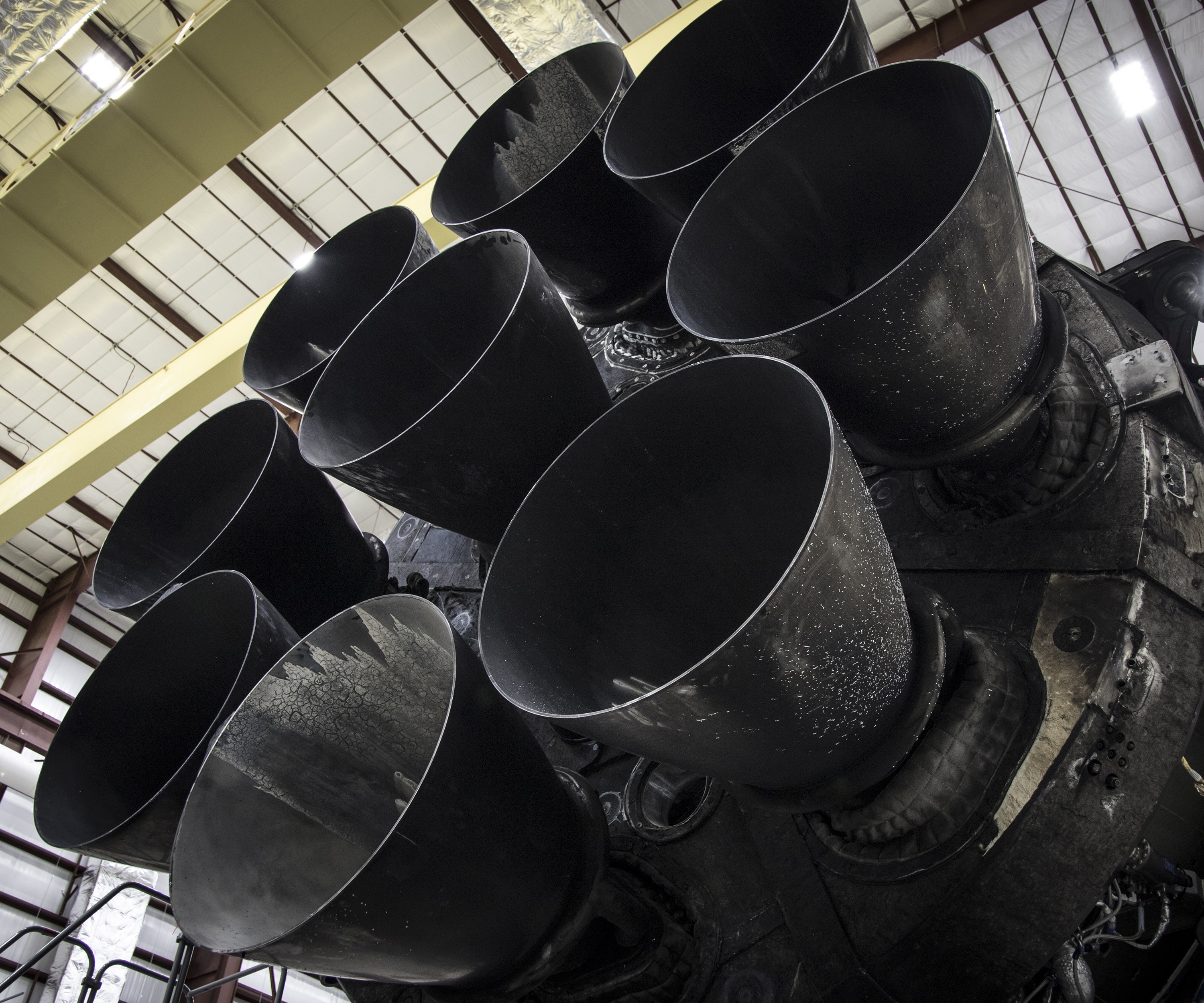 Falcon 9 first stage in hangar, upgraded Merlin engines close-up