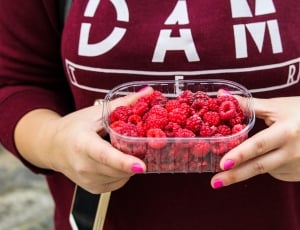 raspberries in plastic container thumbnail