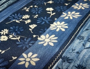 white black and blue floral textile thumbnail
