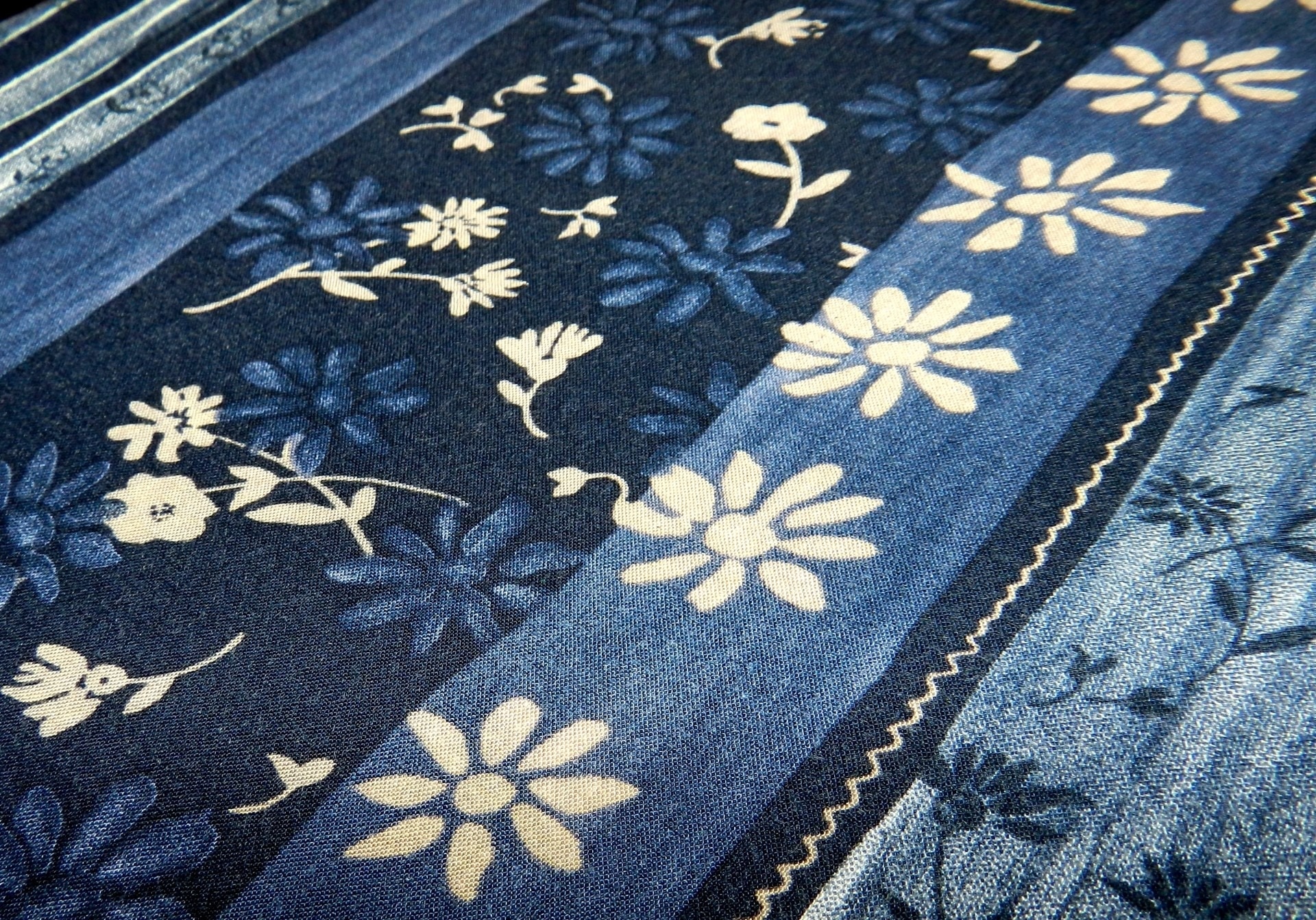 white black and blue floral textile