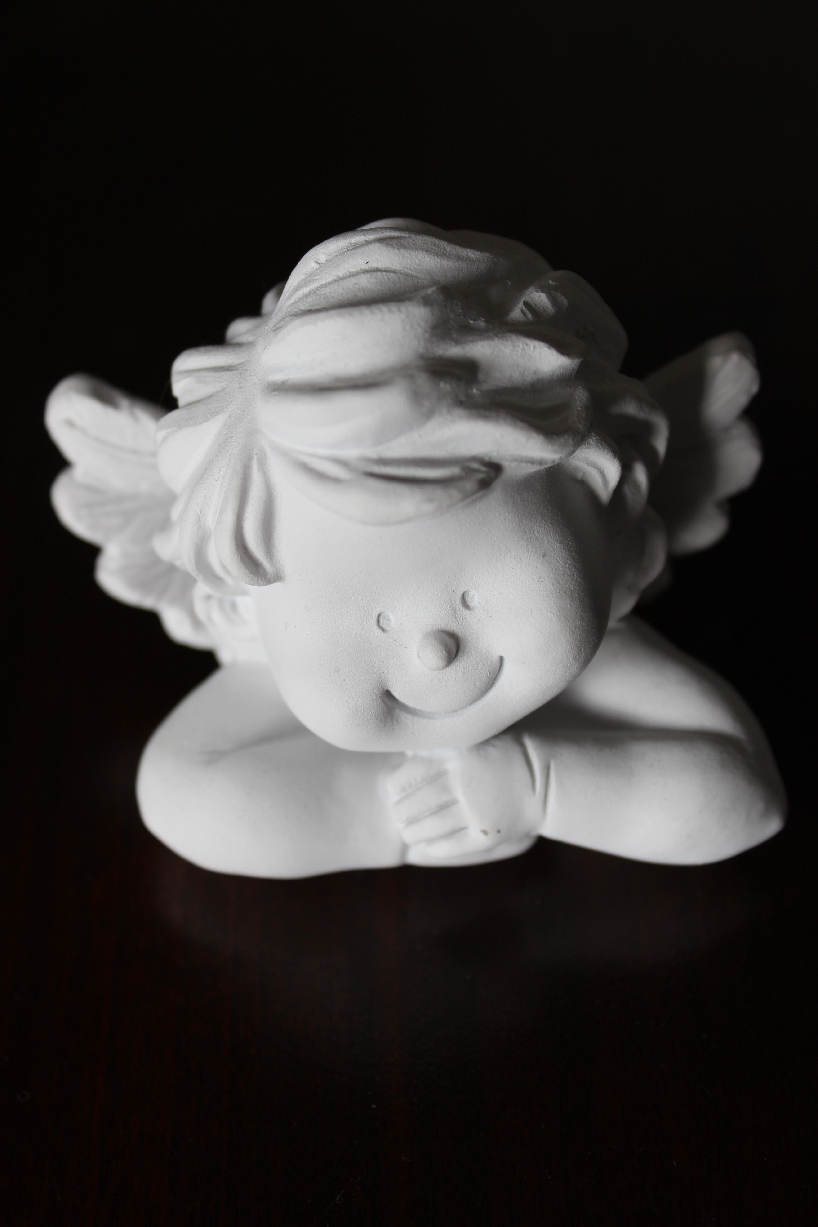 cherub ceramic figurine
