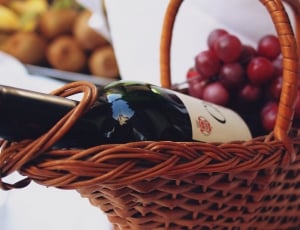 brown wicker basket with wine bottle and grape fruit thumbnail