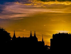 silhouette of buildings during sunset thumbnail
