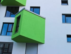 white and green concrete apartment complex thumbnail
