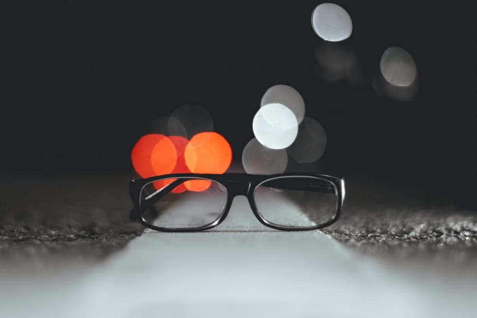 black framed eyeglasses on street preview