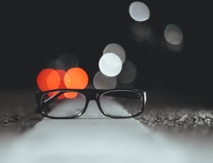black framed eyeglasses on street thumbnail