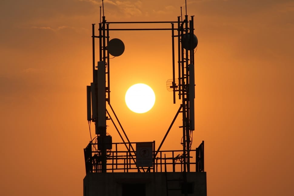 black metal satellite during sunset preview