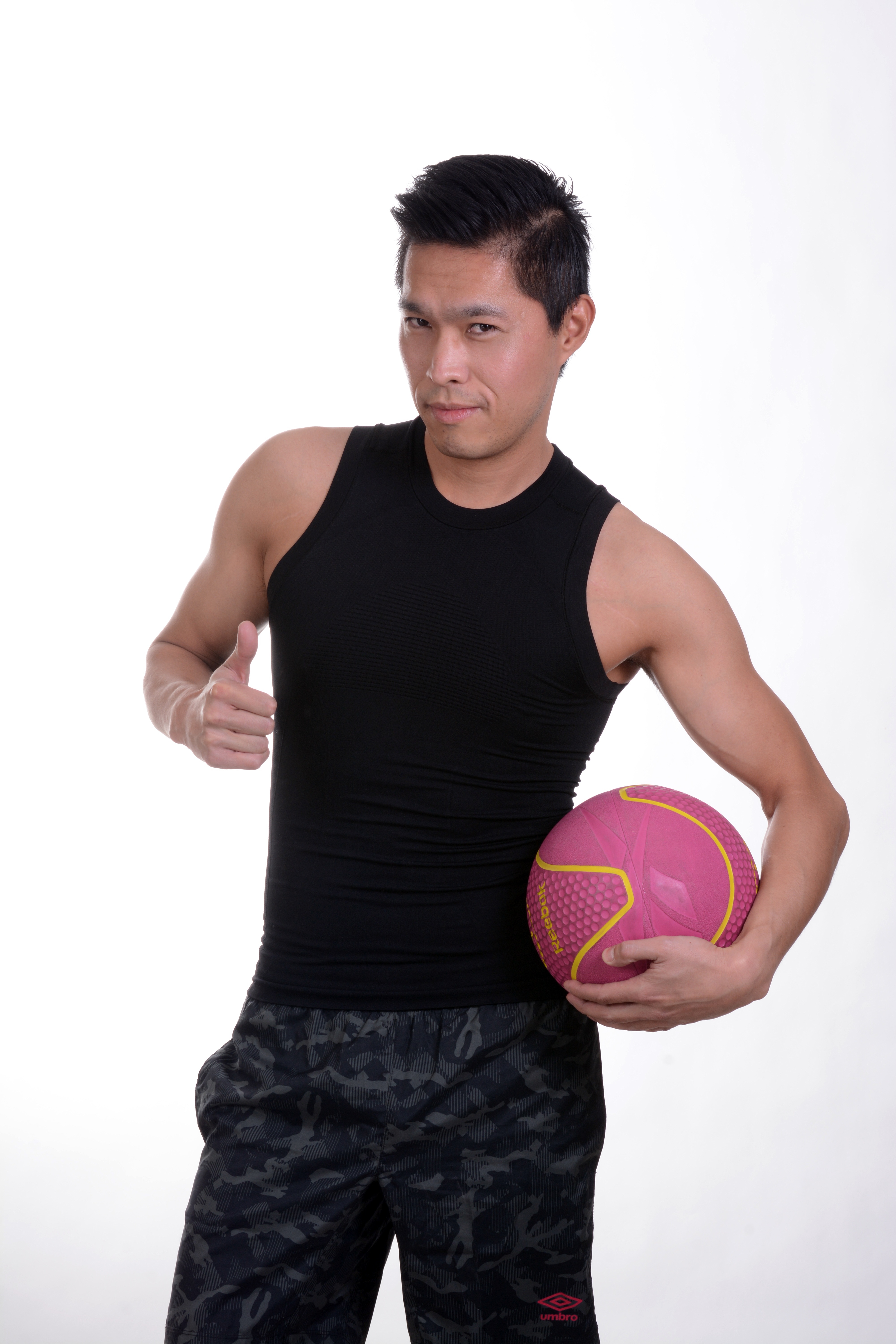 men's black sleeveless crew neck shirt, black-and-gray bottoms with pink exercise ball