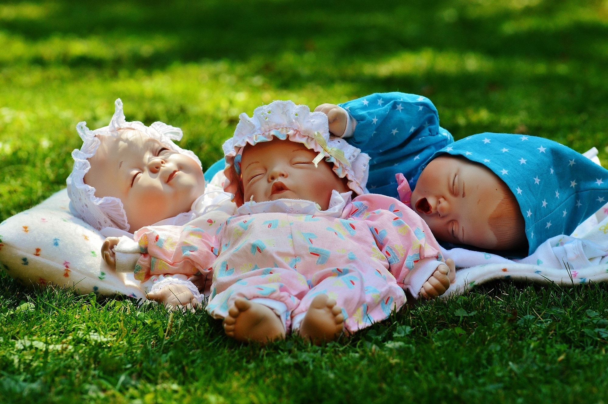 3 dressed baby dolls