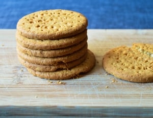 stack of cookies on brown wooden board thumbnail