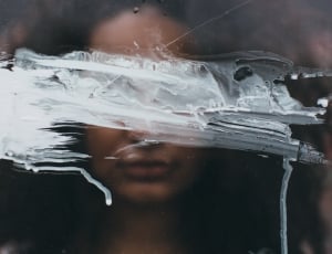 reflection of woman in a white painted mirror thumbnail