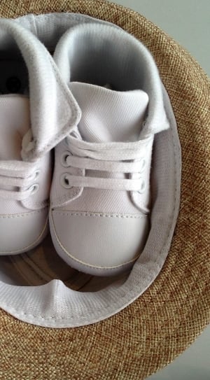 children's pair of white high top shoes thumbnail