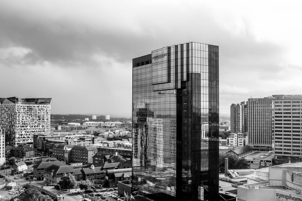 grayscale photo of curtain wall high rise building preview