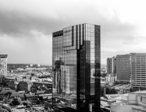 grayscale photo of curtain wall high rise building thumbnail