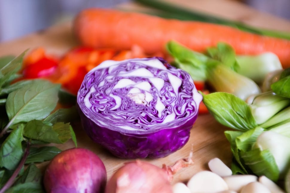 purple onion on brown chopping board preview