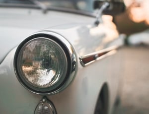 shallow focus photography of car headlight thumbnail