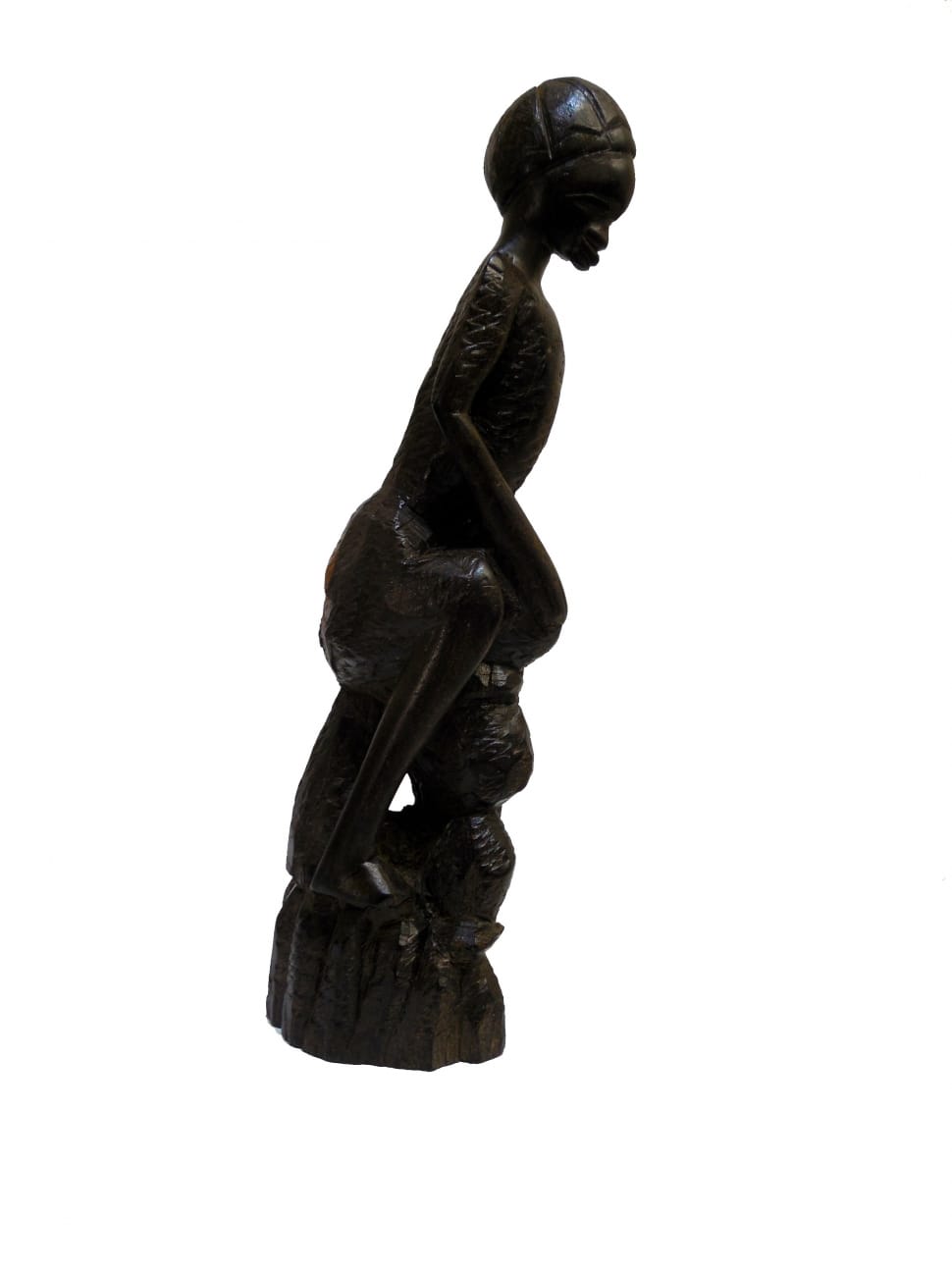 woman sitting black wooden carved decor preview