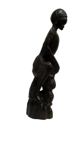 woman sitting black wooden carved decor thumbnail