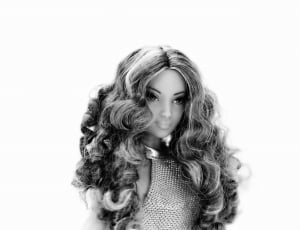 grayscale photo of curly hair doll thumbnail