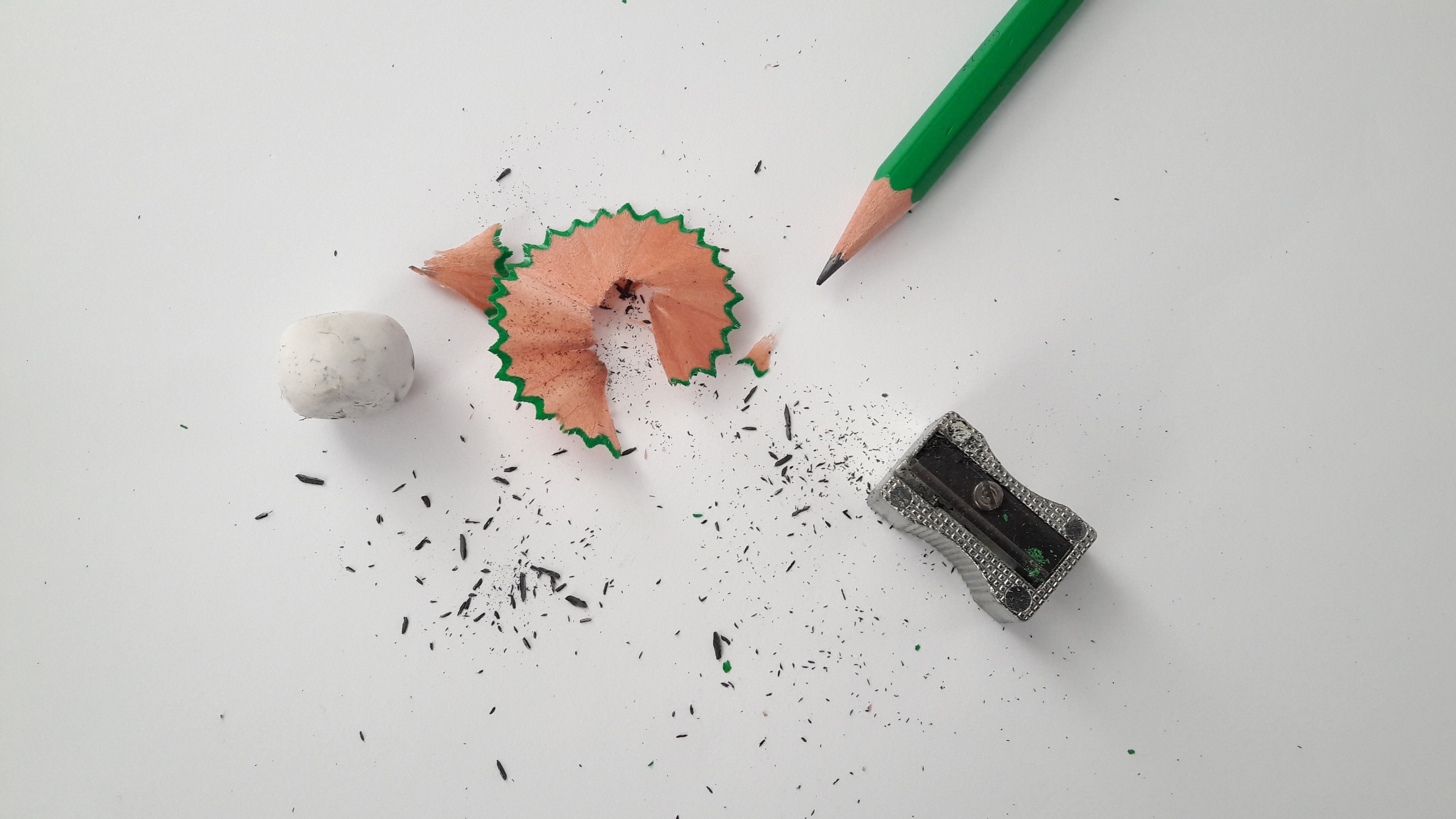 green pencil and gray sharpener