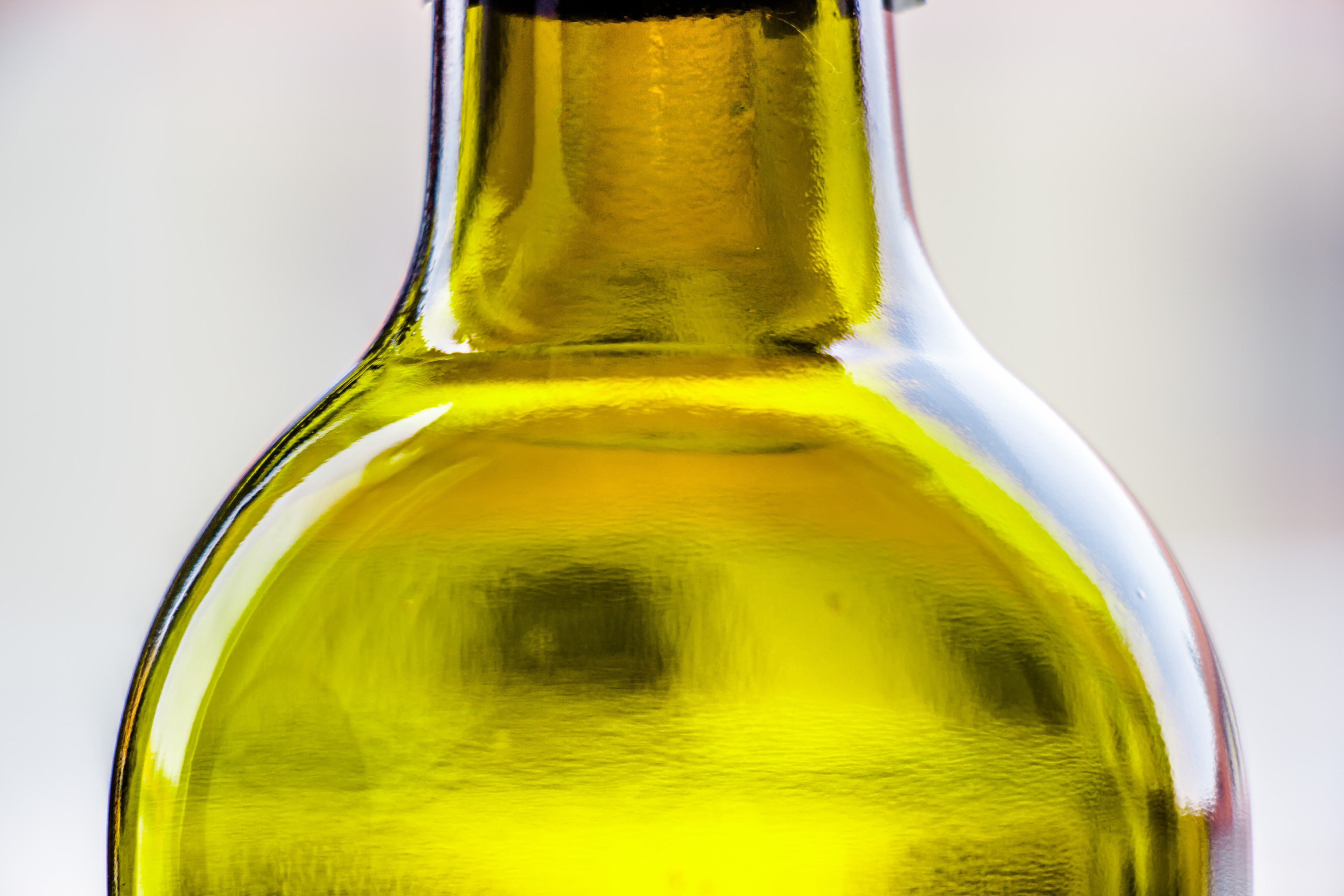 yellow translucent glass bottle