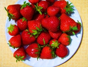 strawberries and white ceramic plate thumbnail