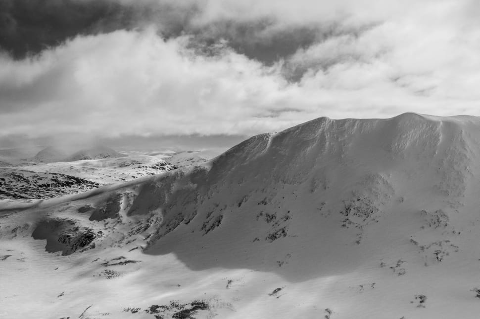grayscale photograph of snow covered mountain preview